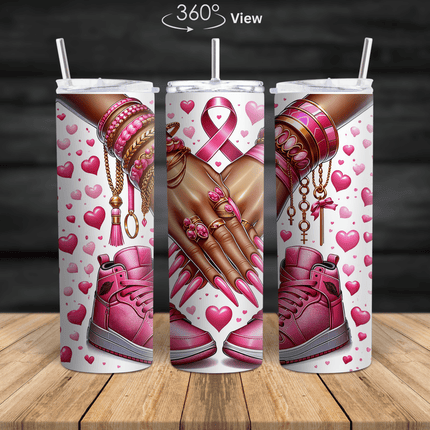 Breast cancer awareness tumbler featuring pink ribbon art, pink nails, gold jewelry, pink sneakers and hearts design.