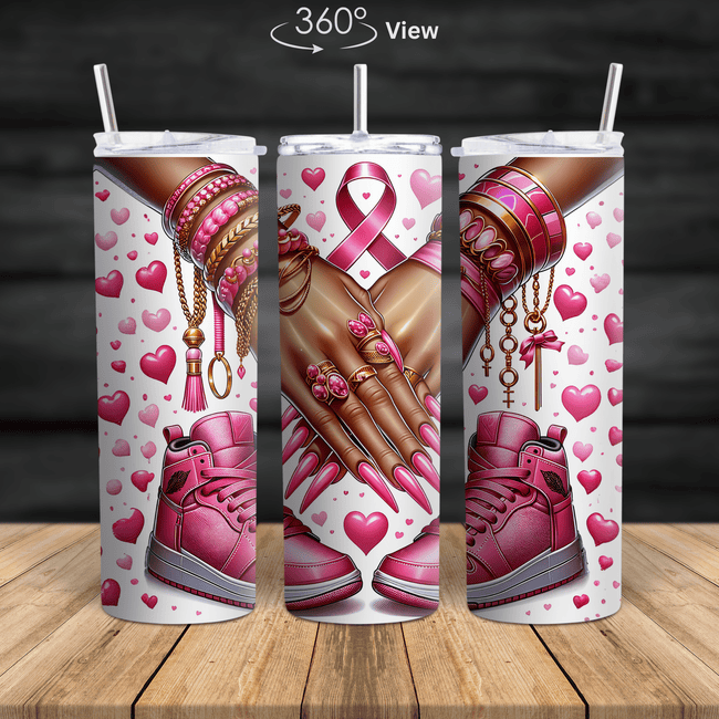Breast cancer awareness tumbler featuring pink ribbon art, pink nails, gold jewelry, pink sneakers and hearts design.