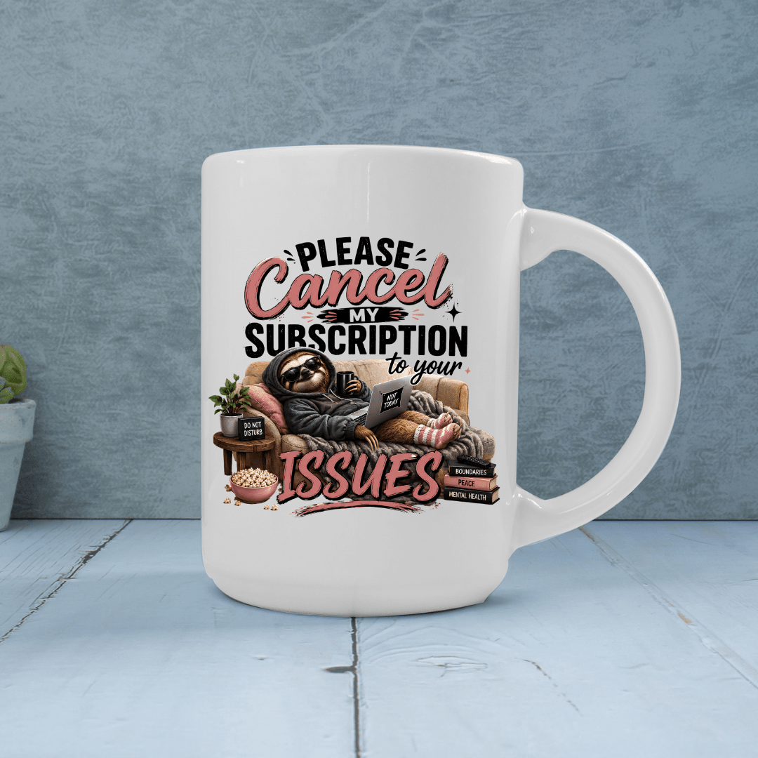 White sarcastic coffee mug featuring a lounging sloth, cozy blanket, laptop and bold Please Cancel My Subscription to Your Issues artwork.