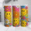 Retro smiley flower skinny tumbler featuring colorful flowers, hearts, butterflies, and bright happy face artwork by the pool.
