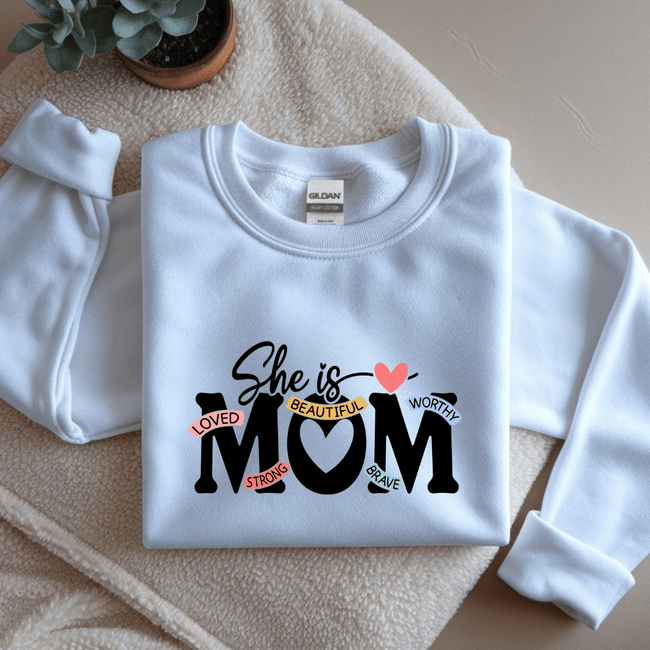 White crewneck sweatshirt with inspirational mom quote design in a clean minimalist style