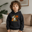 Black youth Halloween dinosaur hoodie featuring a spooky T Rex, orange pumpkins, white ghosts, bats, candy corn and black cat.
