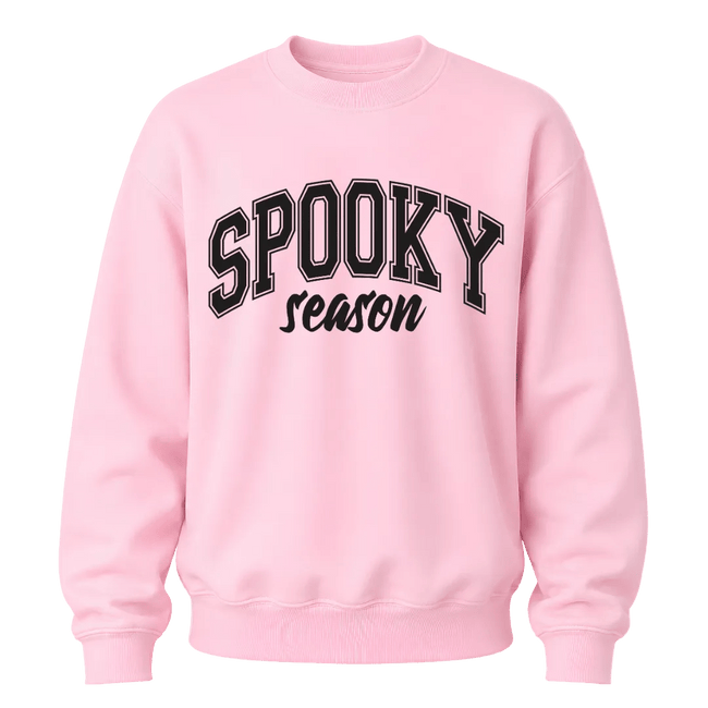 Light pink Spooky Season crewneck sweatshirt featuring black collegiate Halloween lettering for women and fall outfits