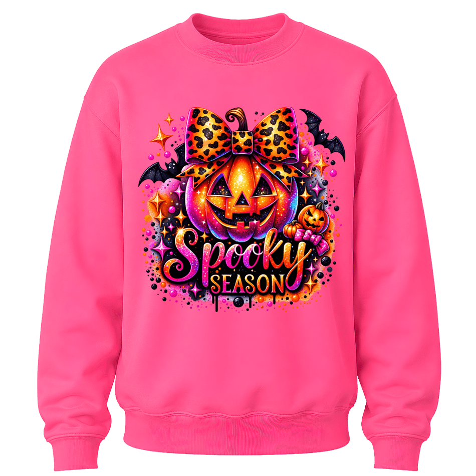Safety Pink youth girls Halloween crewneck featuring a bright jack o lantern, leopard bow and colourful Spooky Season design