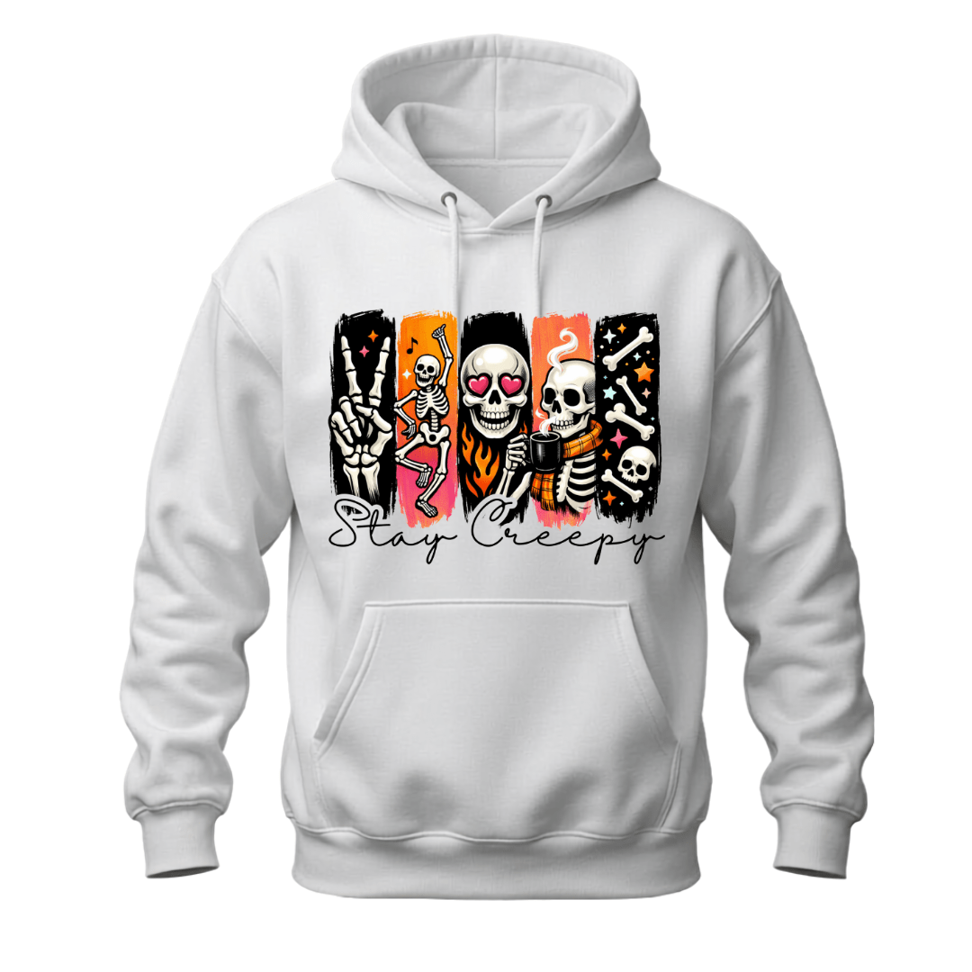 A white pullover hoodie with a graphic print on the chest featuring stylized skeletons in colorful panels and the text 'Stay Creepy' in black script.