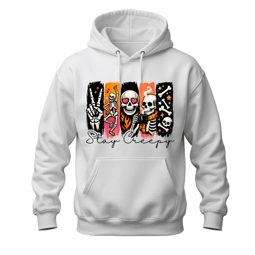 A white pullover hoodie with a graphic print on the chest featuring stylized skeletons in colorful panels and the text 'Stay Creepy' in black script.