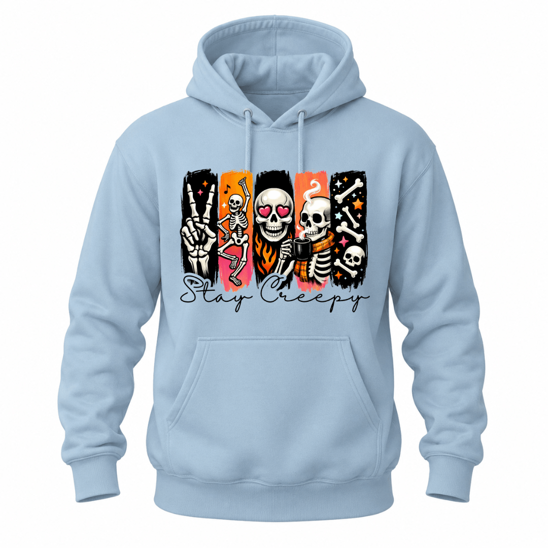 A light blue pullover hoodie with a front kangaroo pocket and a graphic print of a brown grizzly bear walking among pine trees on the chest, shown against a plain white background.