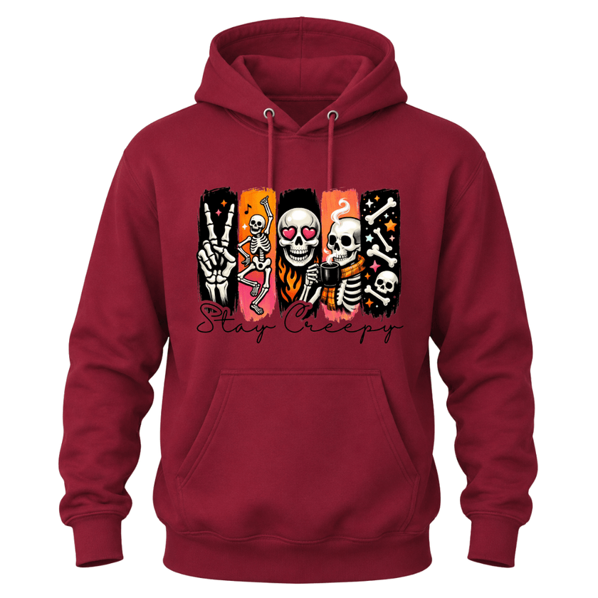 A cardinal red pullover hoodie with a graphic on the chest showing five vertical panels with cartoon skeletons and the text 'Stay Creepy' in black script below, displayed on a plain white background.