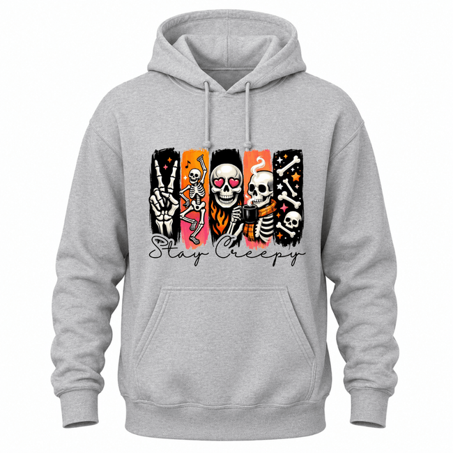 A light gray heather pullover hoodie with a graphic print of five stylized skeletons in different poses on a black, orange, and pink background, with the text 'Stay Creepy' written below in black script.