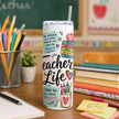 Teacher Life skinny tumbler cup featuring classroom inspired artwork with books, pencils, crayons, flowers, apple, and teacher quotes.