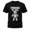 Black men’s Thinking of You shirt featuring distressed white text and detailed white voodoo doll graphic