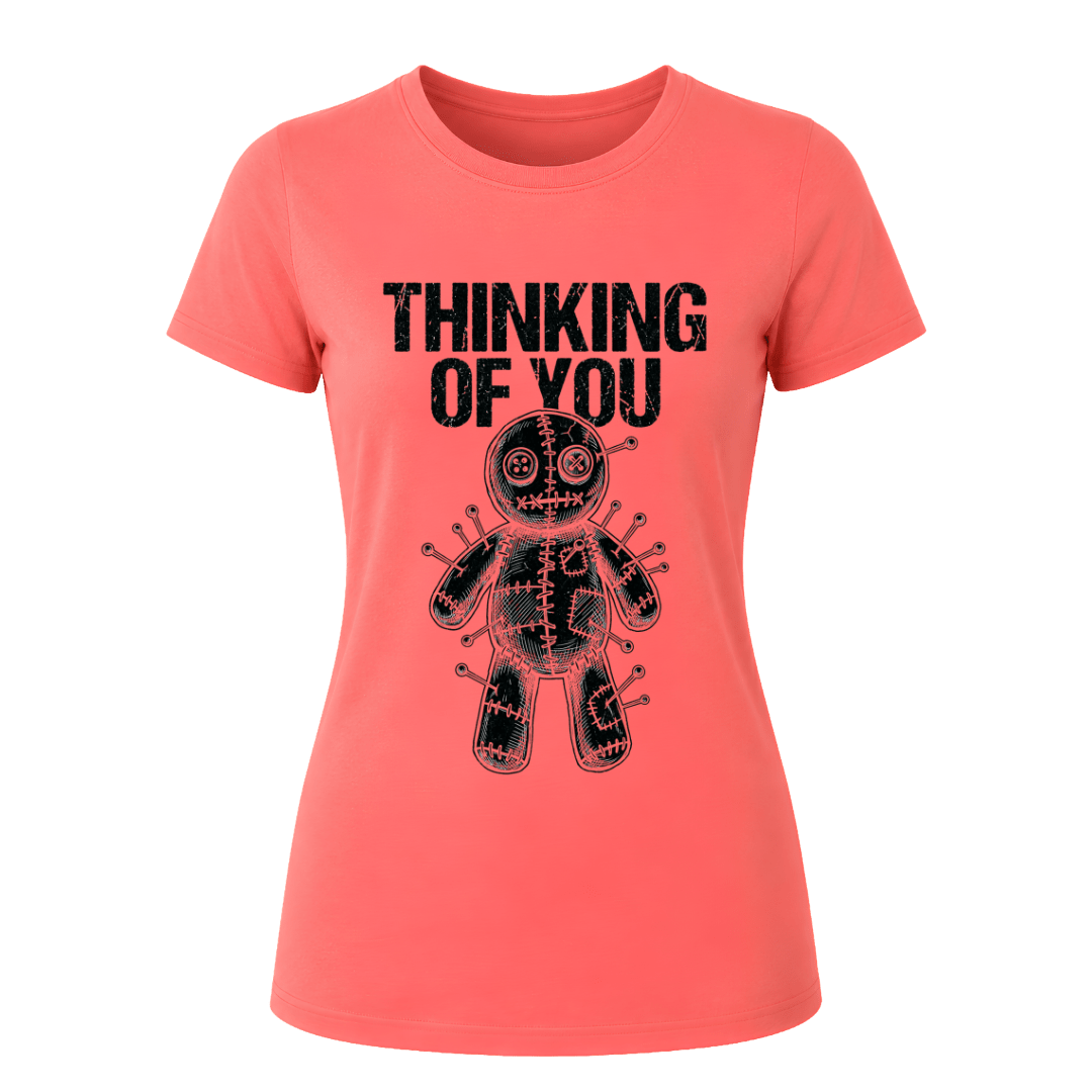 Coral Silk women’s dark humor graphic tee featuring black Thinking of You wording and pinned voodoo doll illustration