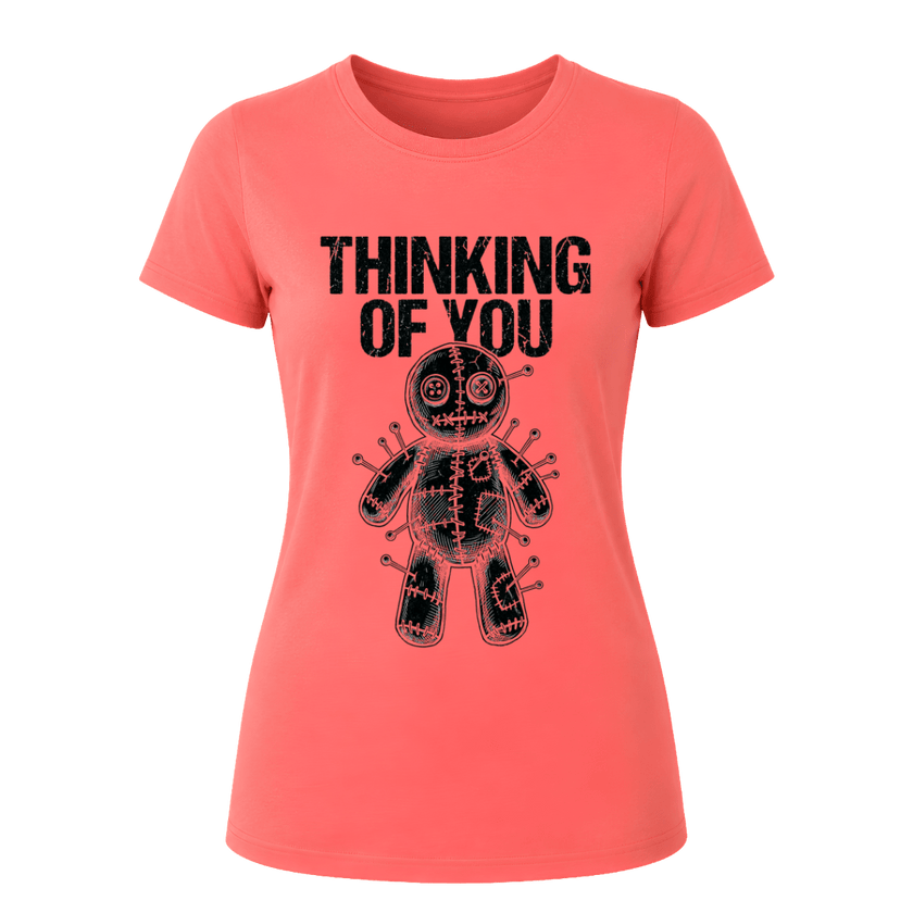 Coral Silk women’s dark humor graphic tee featuring black Thinking of You wording and pinned voodoo doll illustration