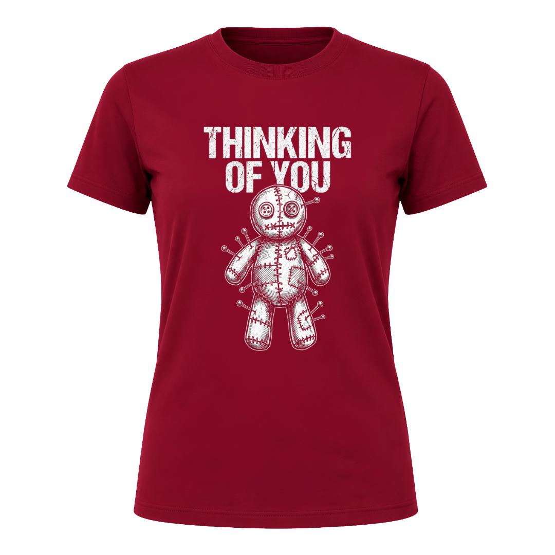 Cardinal Red women’s Thinking of You graphic tee featuring a white illustrated voodoo doll surrounded by pins