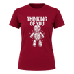 Cardinal Red women’s Thinking of You graphic tee featuring a white illustrated voodoo doll surrounded by pins