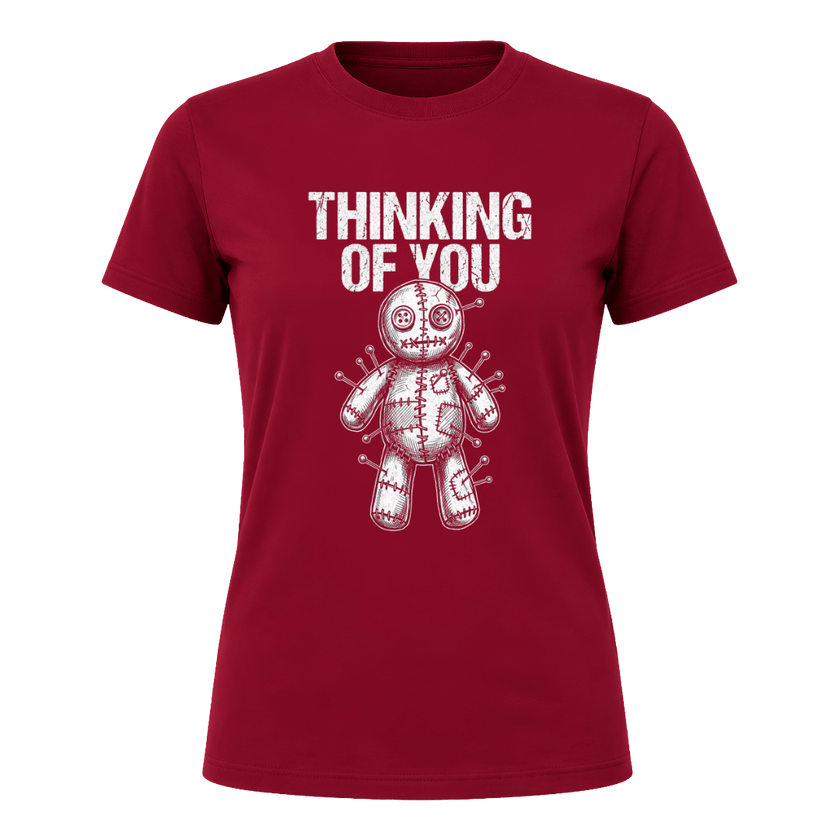 Cardinal Red women’s Thinking of You graphic tee featuring a white illustrated voodoo doll surrounded by pins