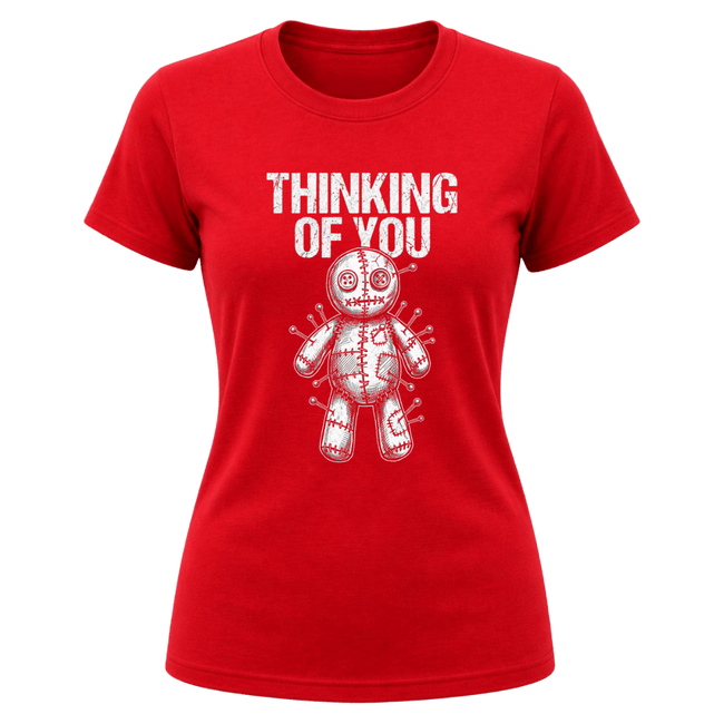 Red women’s Thinking of You graphic tee with white distressed typography and pinned voodoo doll illustration