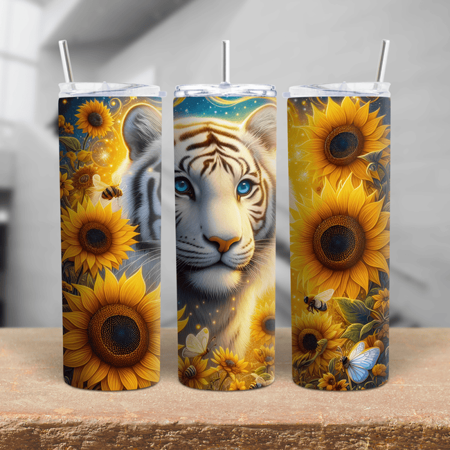 A vibrant tumbler featuring a white tiger surrounded by bright sunflowers, bees, and butterflies. on a stainless steel cup.