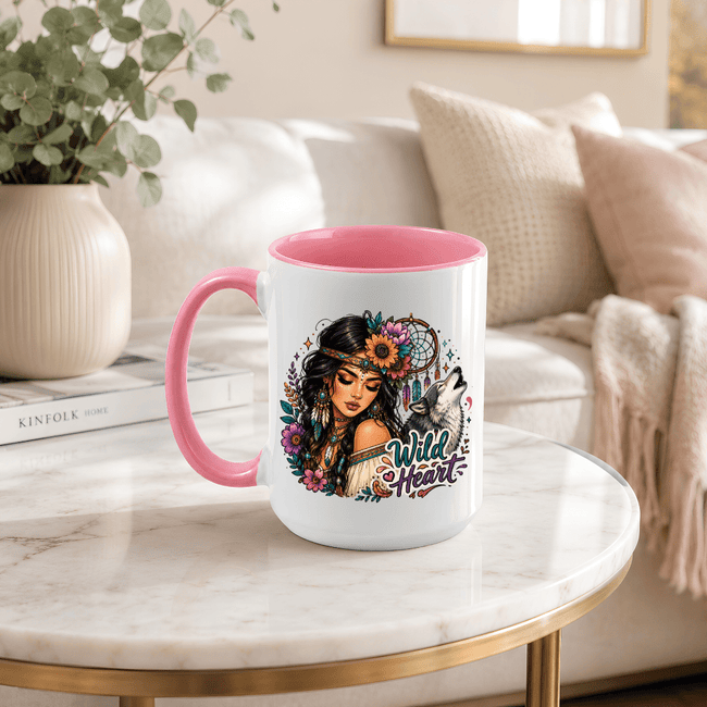 Wild Heart ceramic mug with pink handle and interior featuring a woman, howling wolf, florals and colourful bohemian artwork