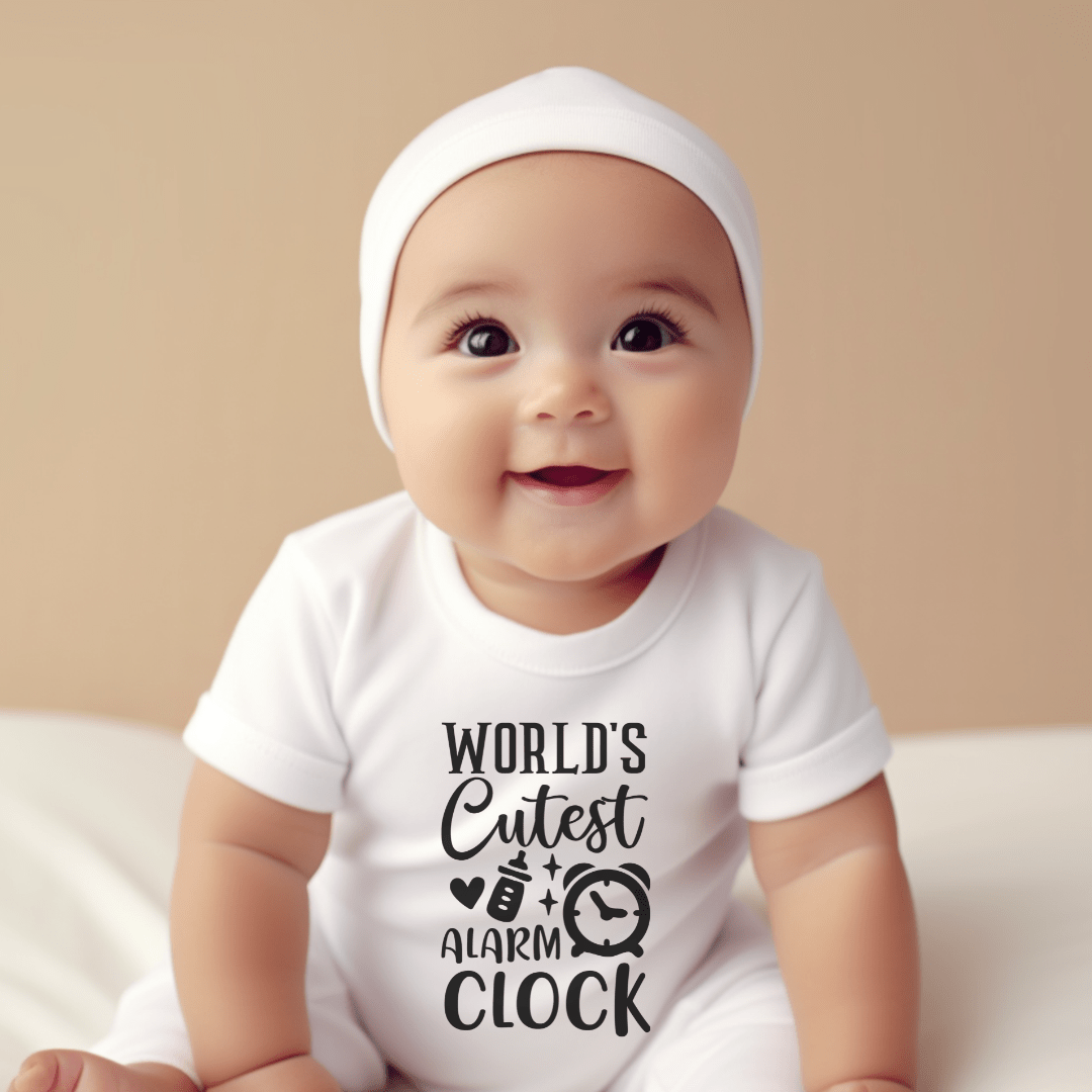 Smiling baby wearing funny World’s Cutest Alarm Clock infant bodysuit in soft white cotton fabric