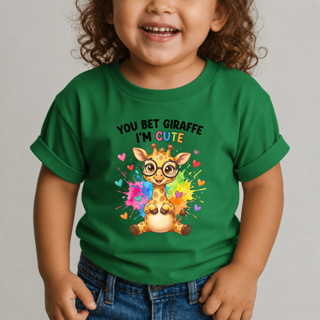 Toddler in green t-shirt with rainbow splash giraffe graphic and colorful hearts print