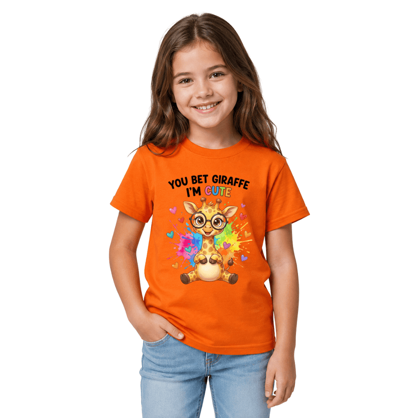 Girl wearing orange youth graphic tee with cute giraffe and rainbow heart design