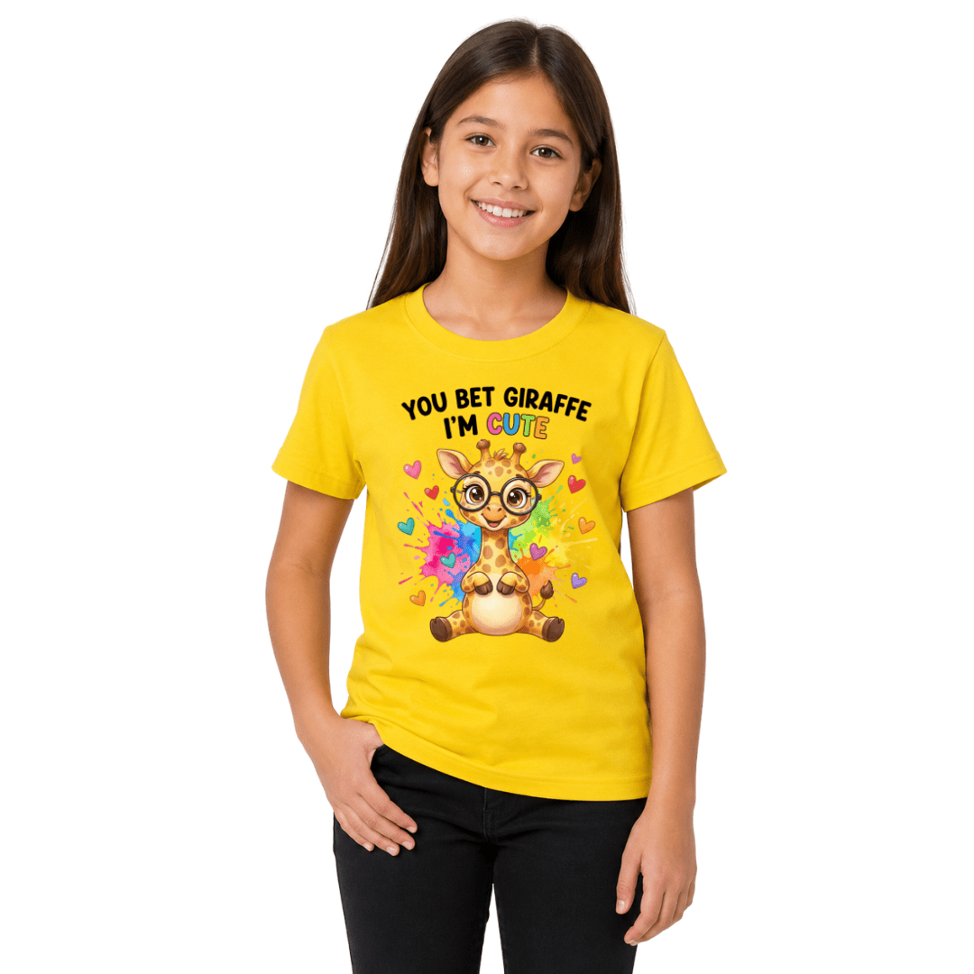 Girl wearing yellow youth t-shirt printed with You Bet Giraffe I'm Cute rainbow design