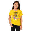 Girl wearing yellow youth t-shirt printed with You Bet Giraffe I'm Cute rainbow design