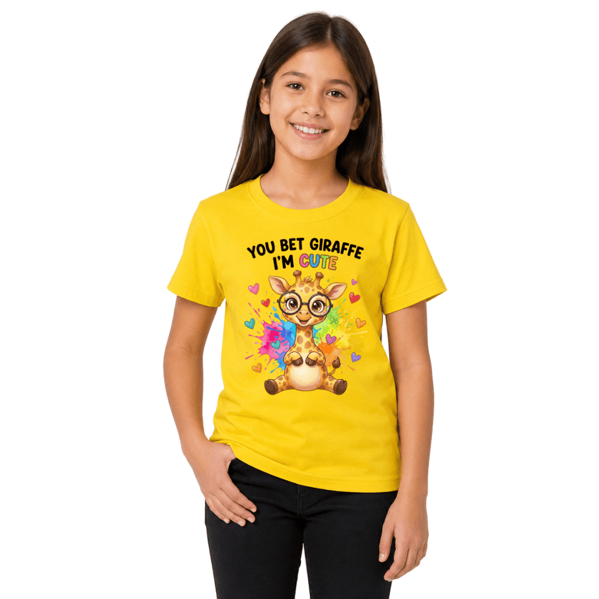 Girl wearing yellow youth t-shirt printed with You Bet Giraffe I'm Cute rainbow design